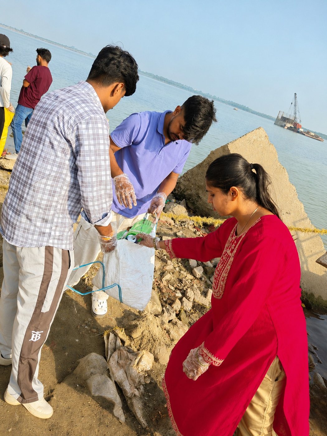 Clearing waste along the riverbank